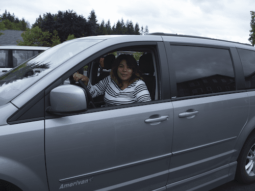 Picture of Dayana Ramos in driver's seat of her adapted van