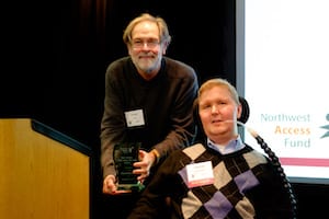 Picture of David Lord with Disability Rights Washington presenting award to Conrad Reynoldson