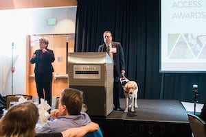 Picture of Mark Adreon accepting award on behalf of WA's Department of Services for the Blind