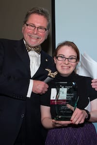 Photo of Ms. Barry accepting award on behalf of Skihawks
