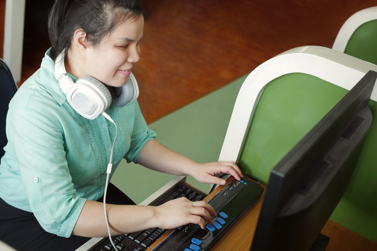visually impaired girl using a computer